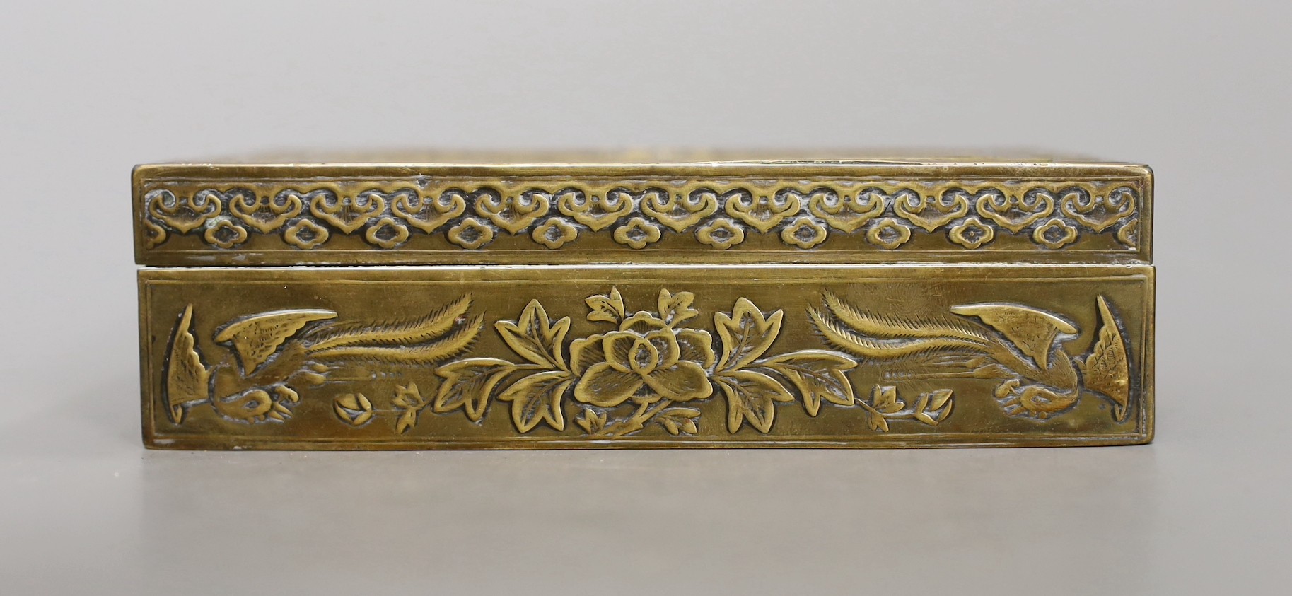 A 1920s Chinese brass 'dragon' cigarette box, 15.5cm